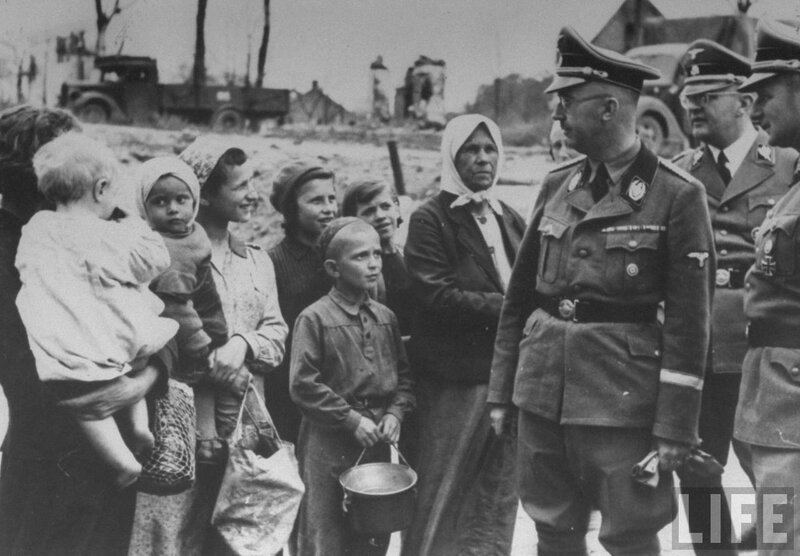 German officer with displaced civilians