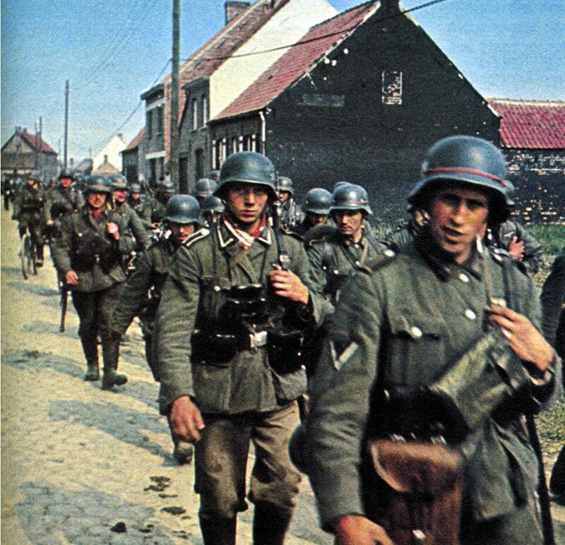 German soldiers marching in a village