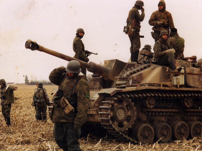 German soldiers with tank in field