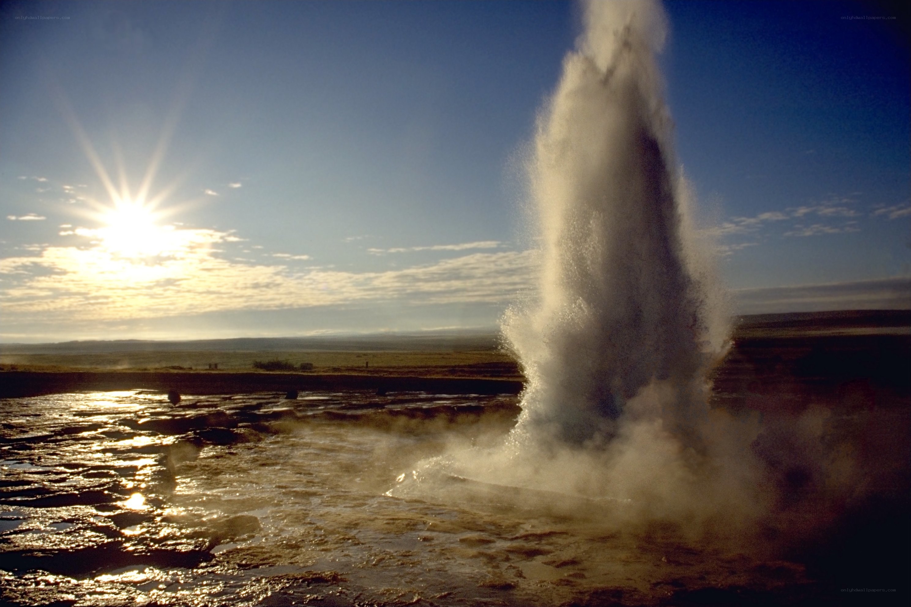 Geyser erupting at sunrise