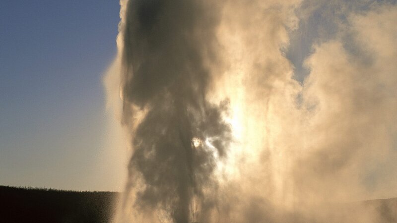 Geyser erupting at sunrise
