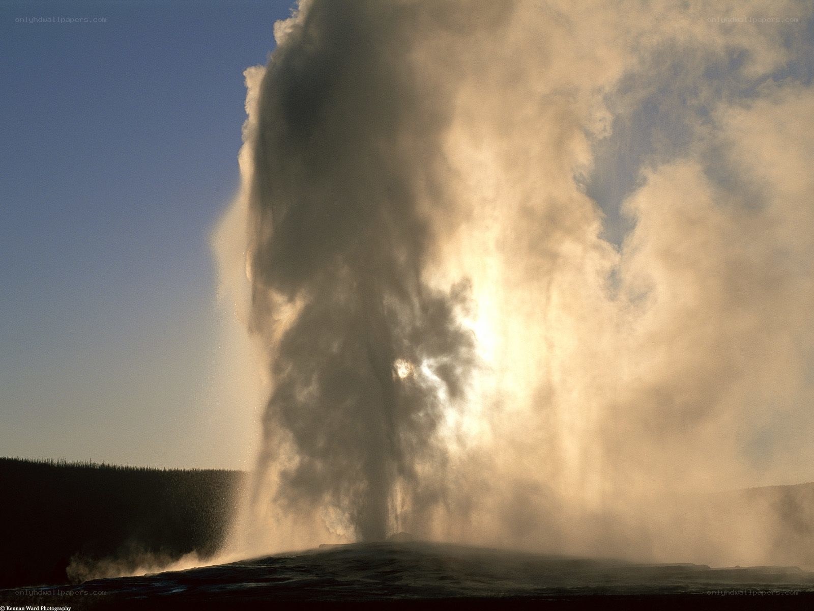 Geyser erupting at sunrise