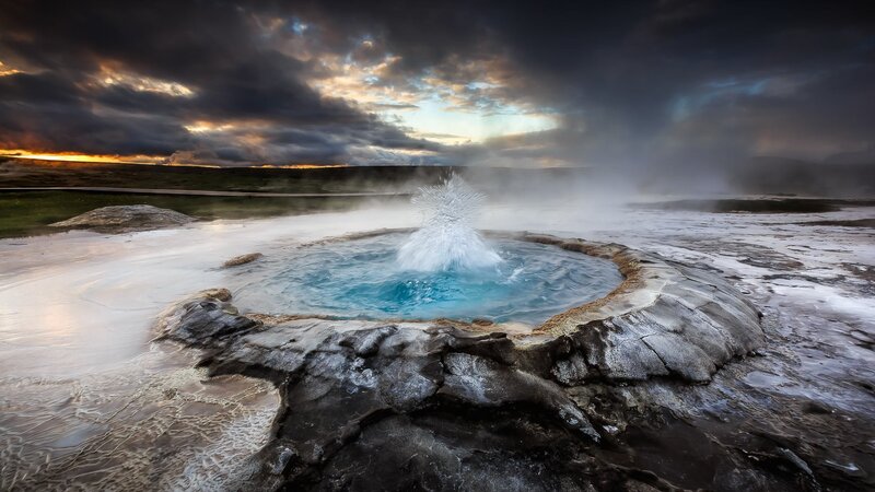 Geyser Erupting at Sunset — Blue, Dramatic, Photograph