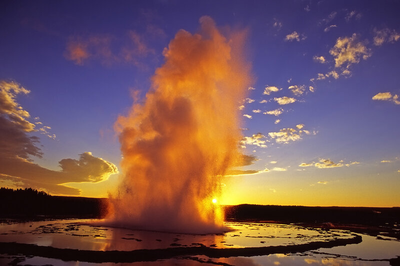 Geyser Erupting at Sunset — Orange, Dramatic, Photograph