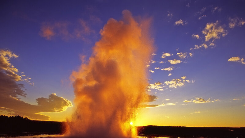 Geyser Erupting at Sunset — Orange, Dramatic