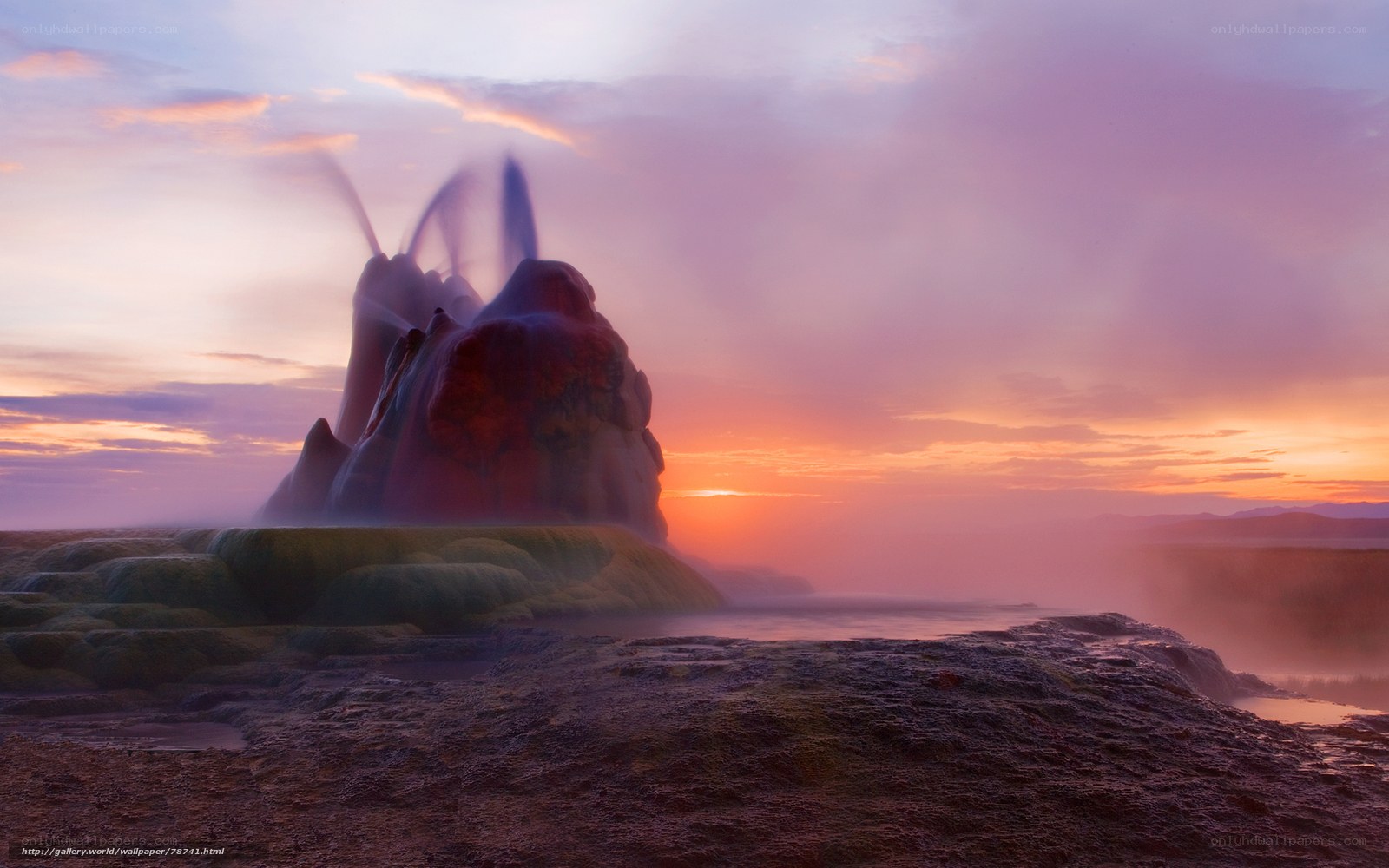 Geyser erupting at sunset