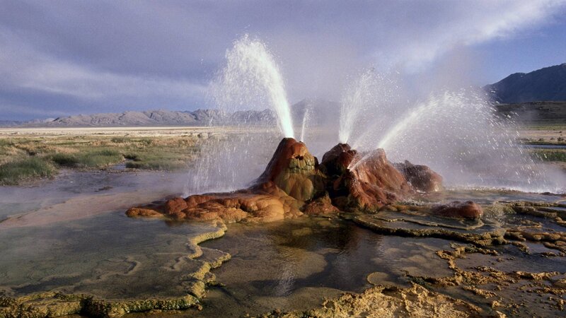 Geyser Erupting — Brown