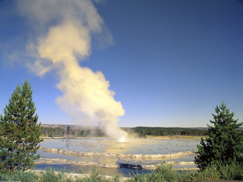 Geyser Erupting in Field — Blue, Dramatic