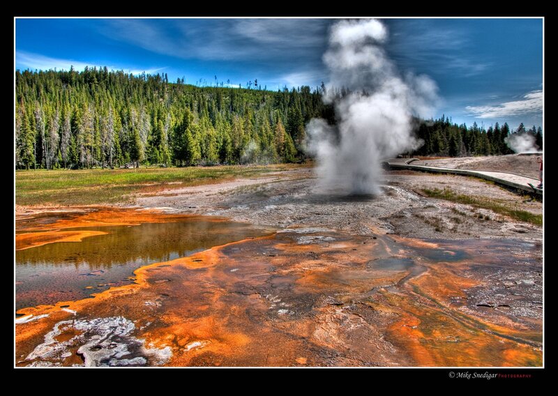 Geyser Erupting in Field