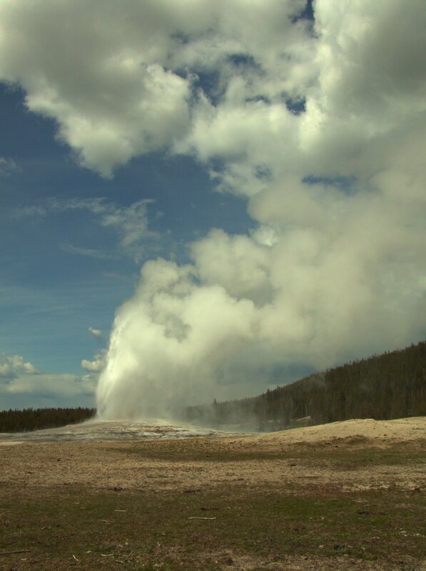 geyser erupting in yellowstone