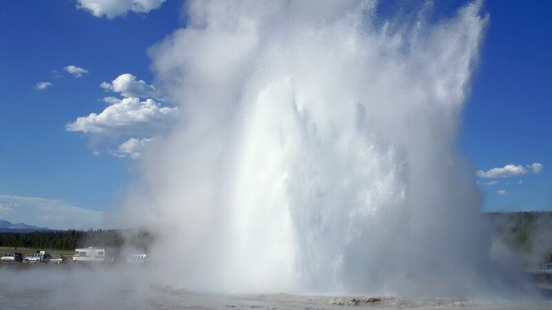 Geyser erupting on a sunny day