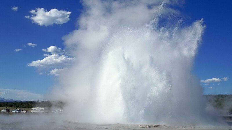 Geyser erupting on a sunny day