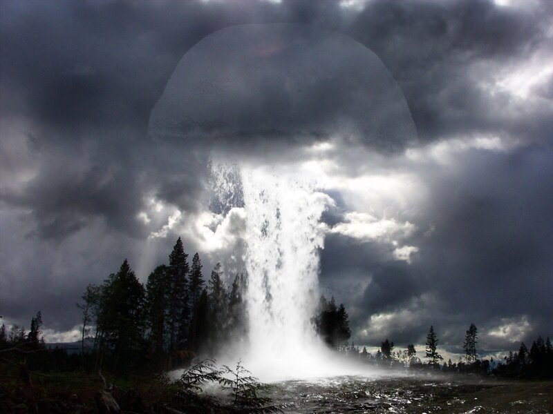geyser erupting under storm clouds