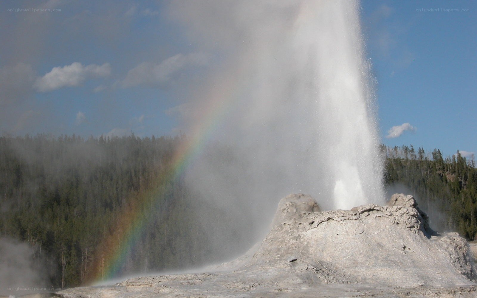 Geyser erupting with rainbow