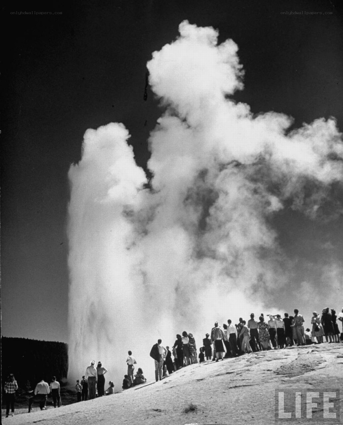 Geyser eruption with onlookers