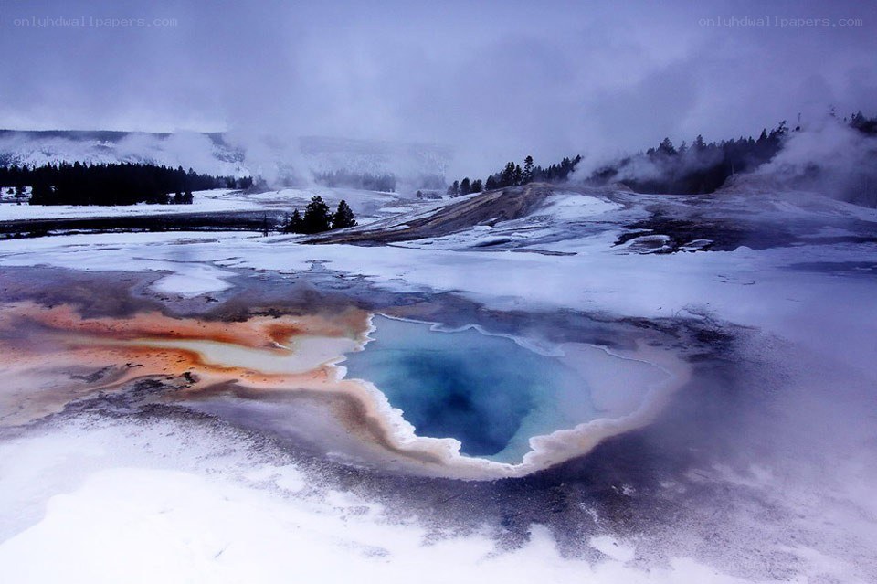 geyser in snowy landscape