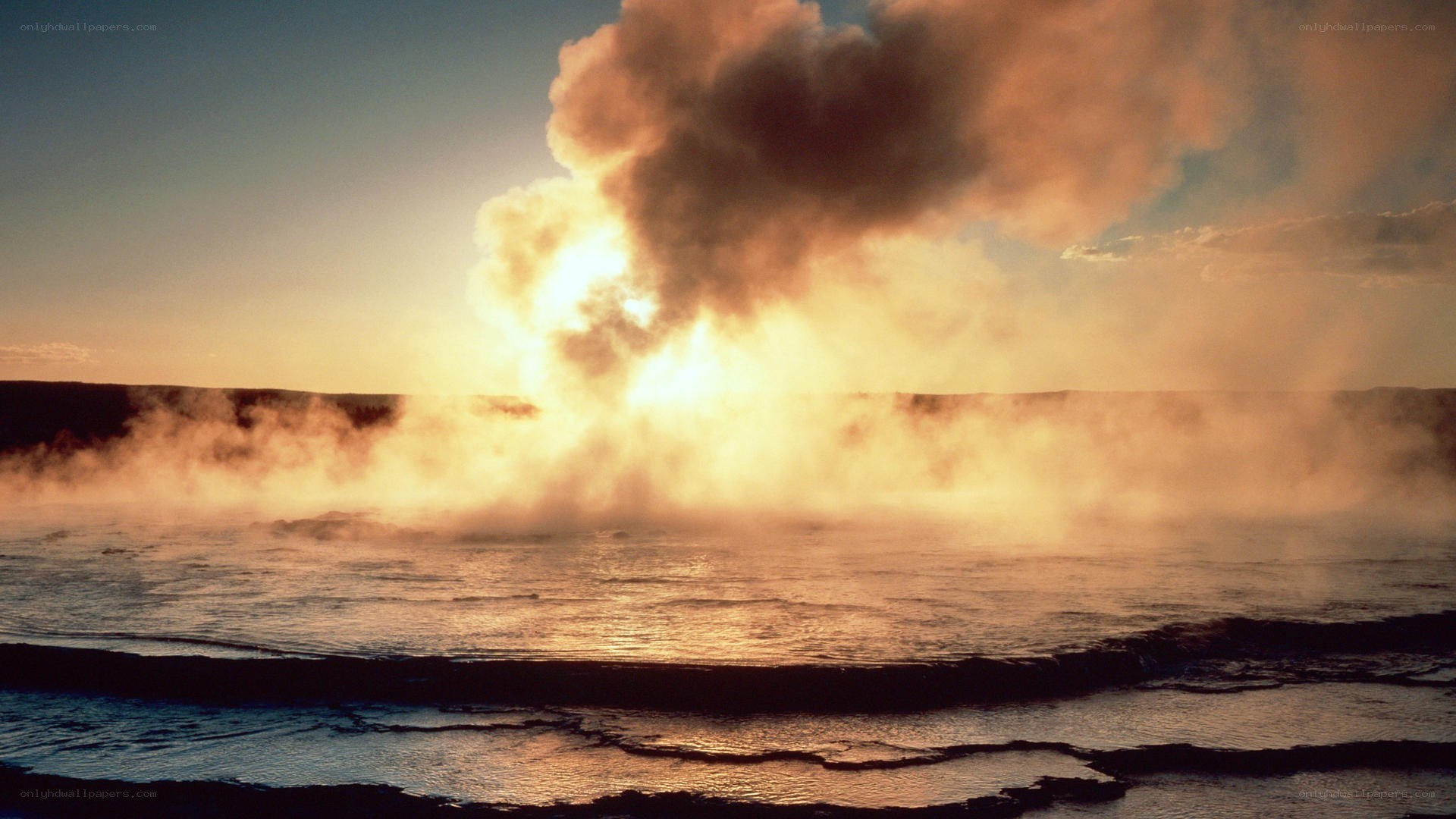 Geysers erupting at sunset
