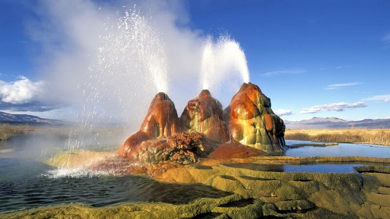 Geysers erupting in a natural landscape