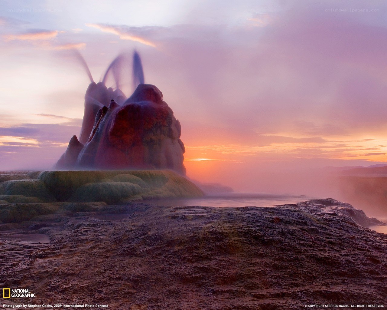 Geysir erupting at sunset