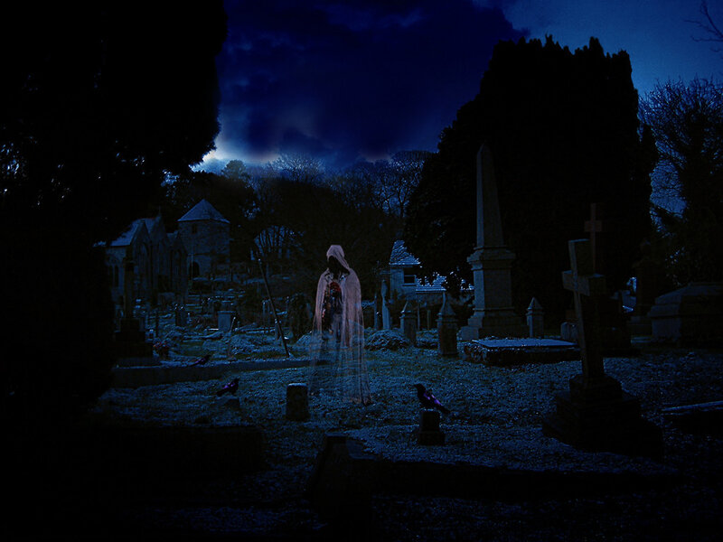 Ghost in a cemetery at night
