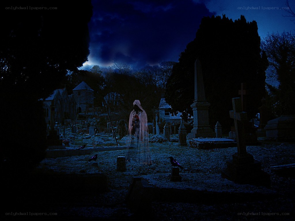 Ghost in a cemetery at night
