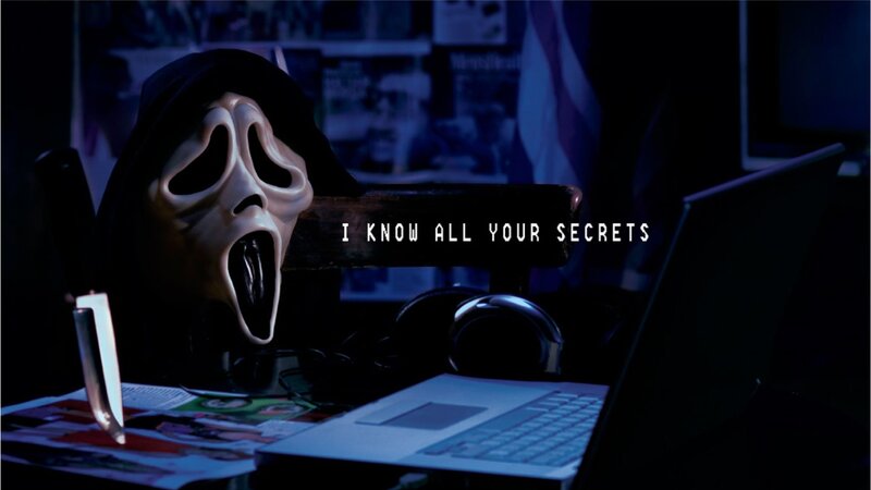 Ghostface at a computer desk