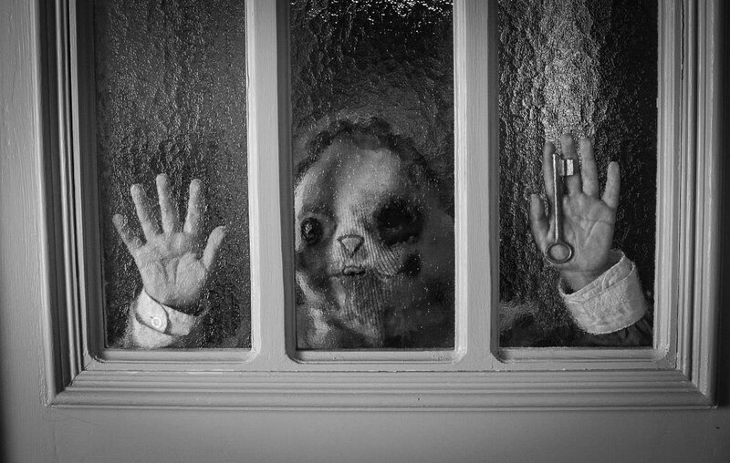 ghostly figure at window