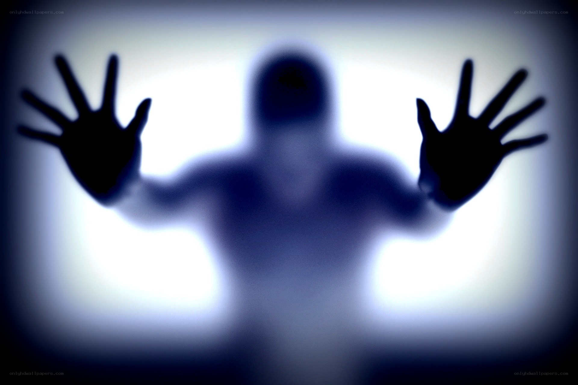 ghostly figure behind glass