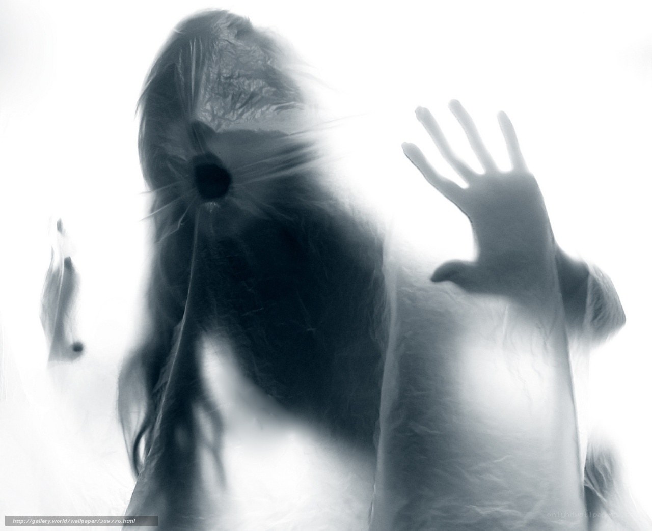 Ghostly figure behind glass