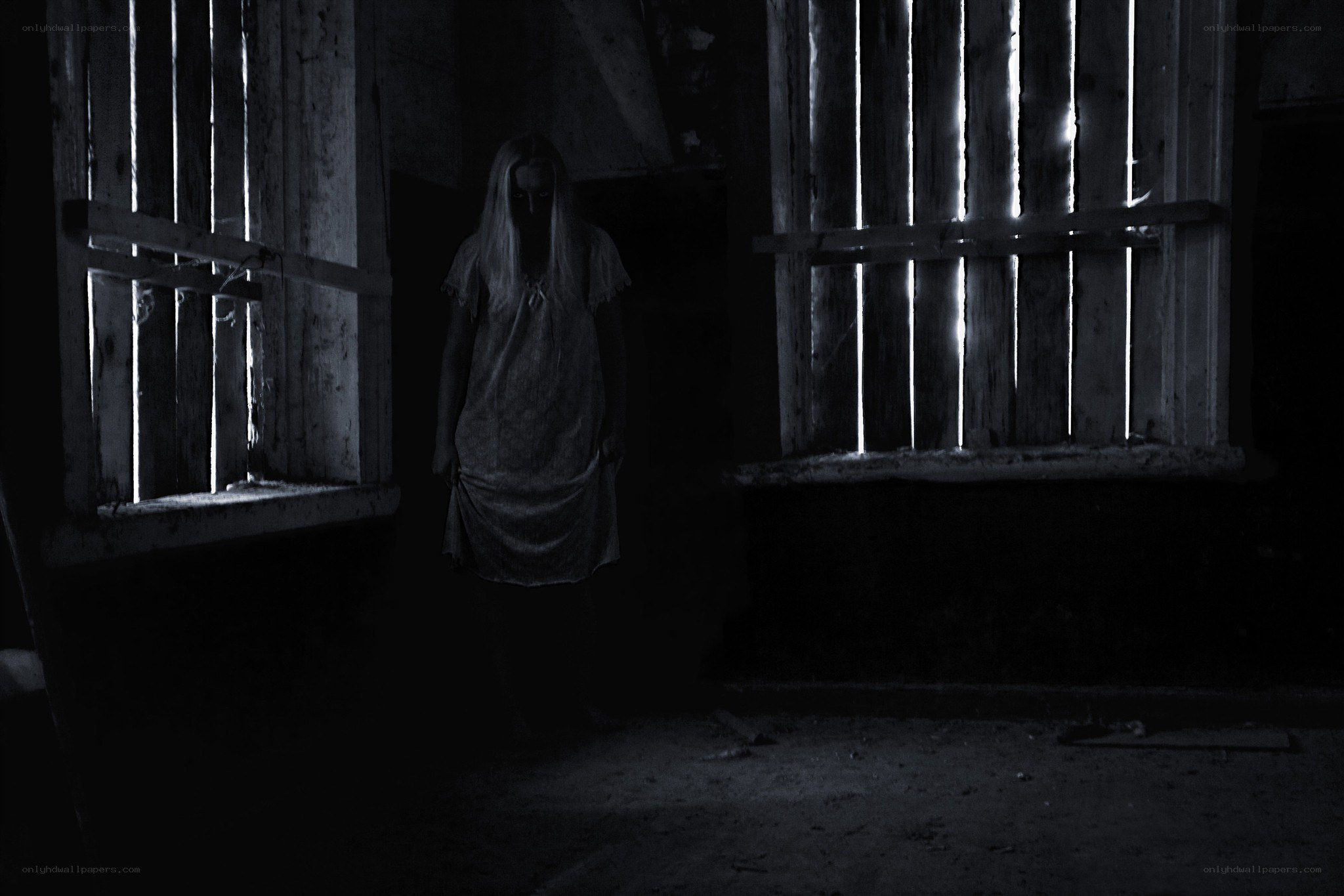 ghostly figure in dark room