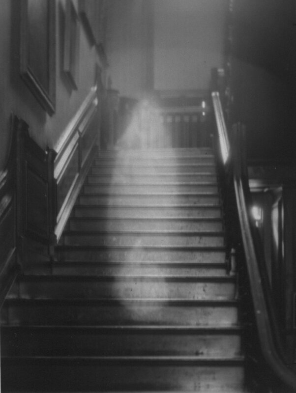 Ghostly figure on staircase