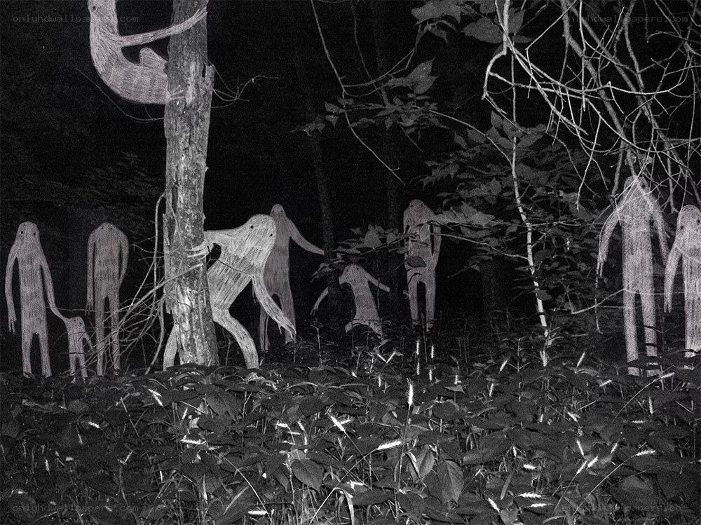 Ghostly figures in a dark forest