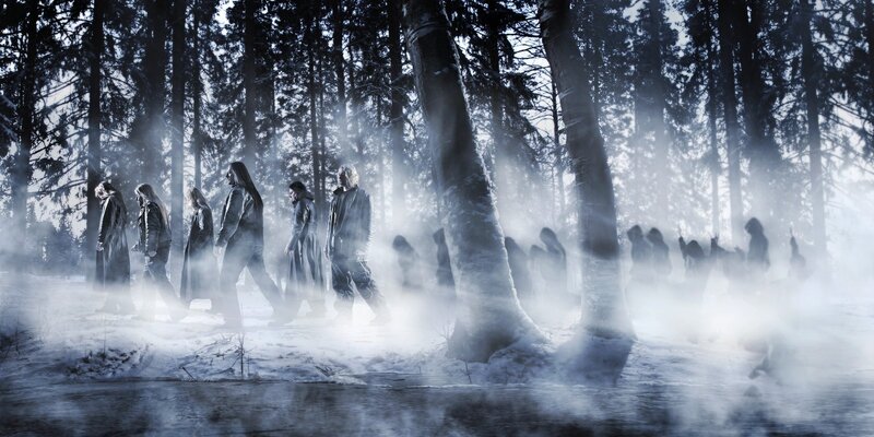 Ghostly figures in a snowy forest