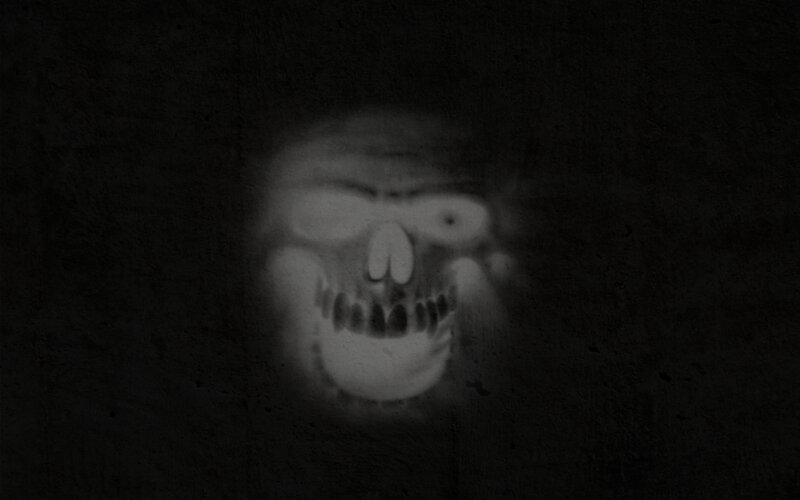 ghostly skull in darkness