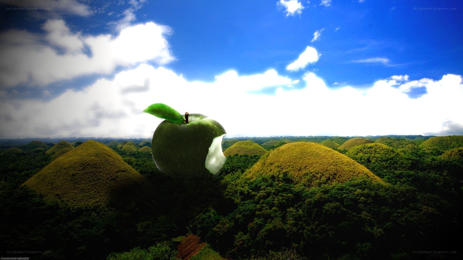 Giant apple over chocolate hills