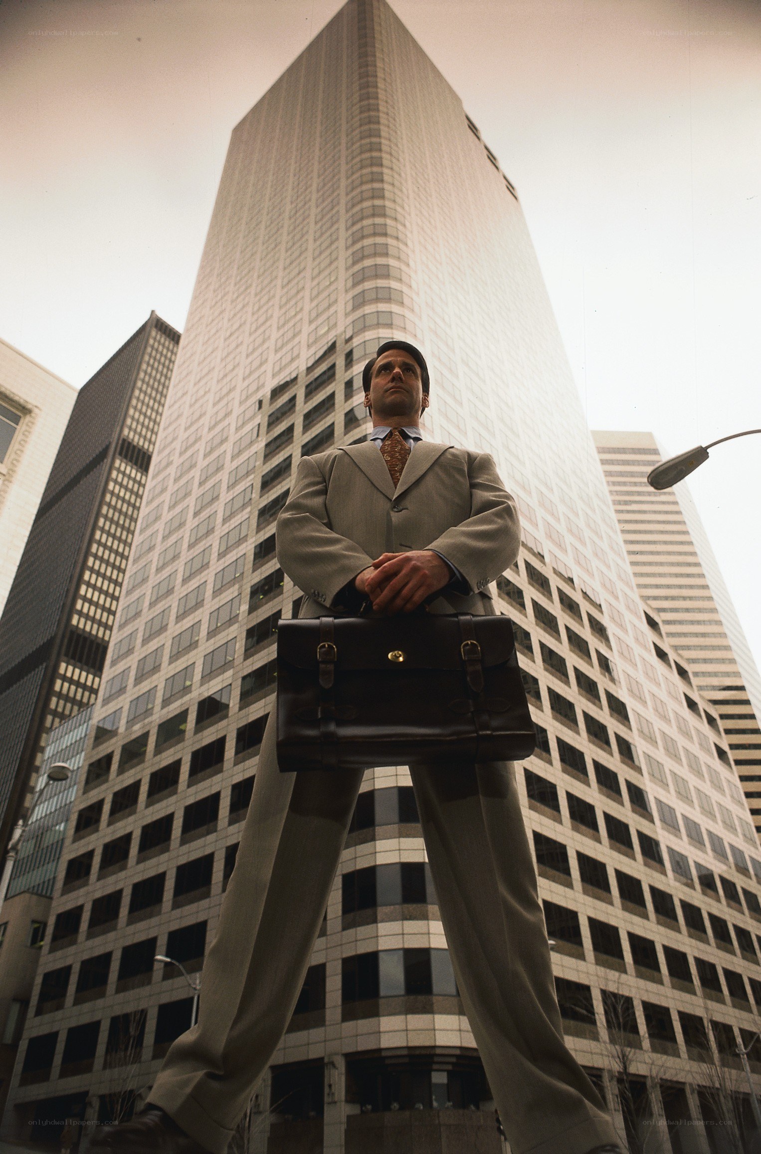 giant businessman in city