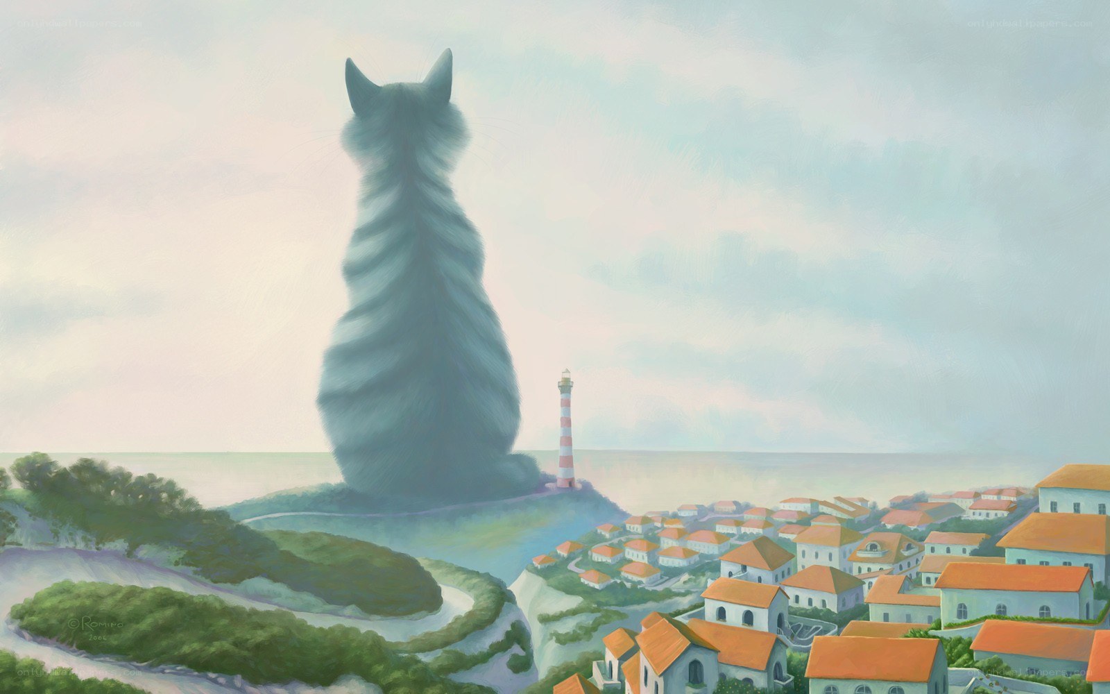 Giant cat overlooks coastal town