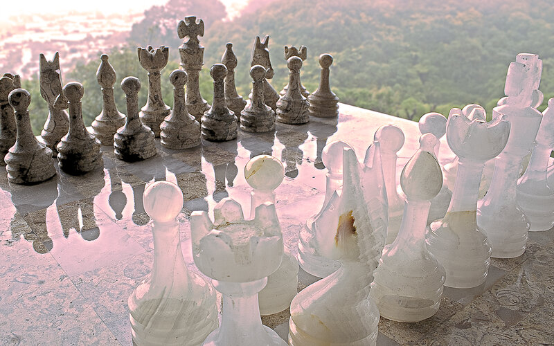 Giant chess set on a hill