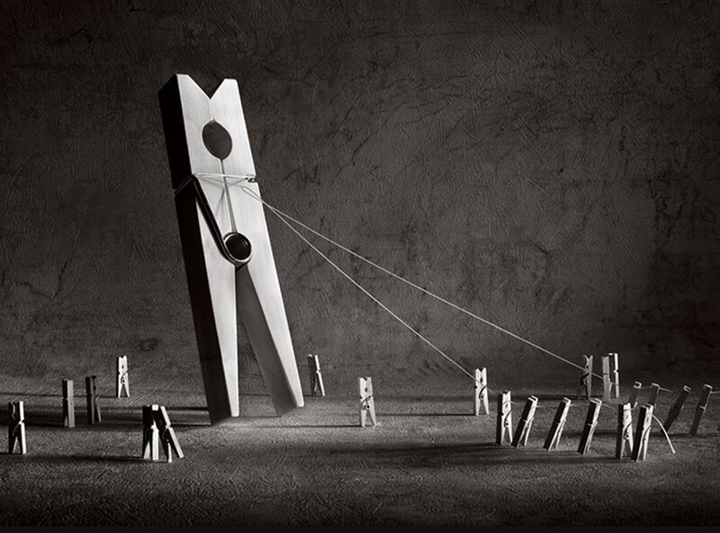 Giant Clothespin Pulling Others