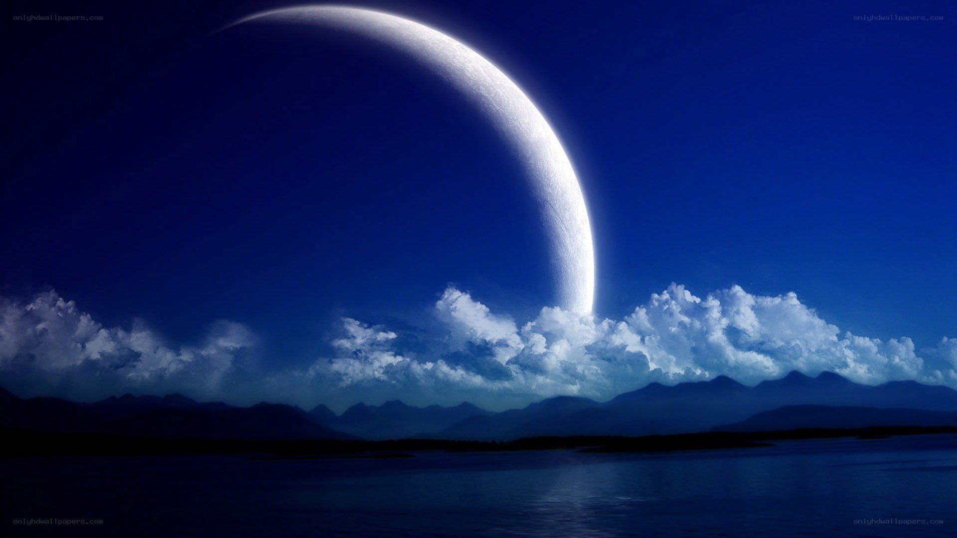 Giant crescent moon over water