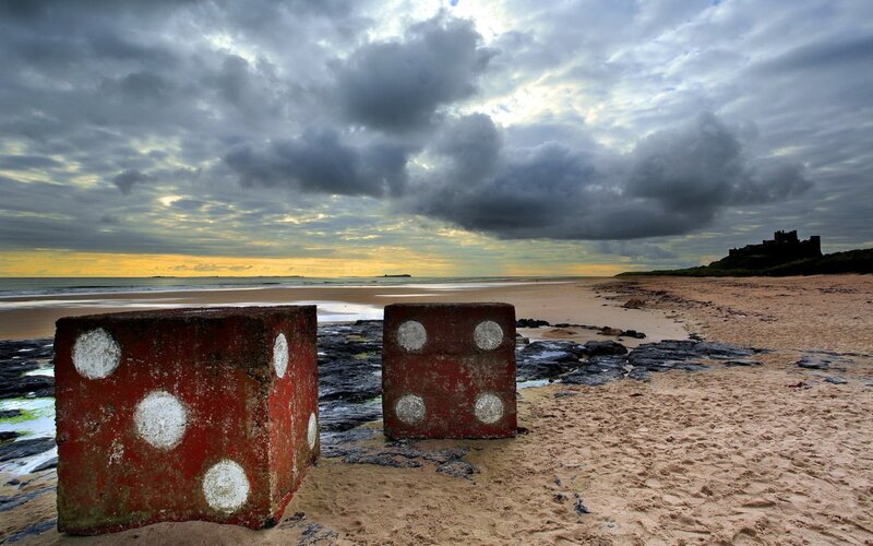 giant dice on a beach