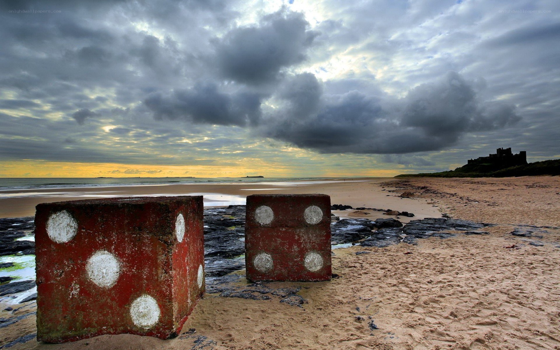 giant dice on a beach