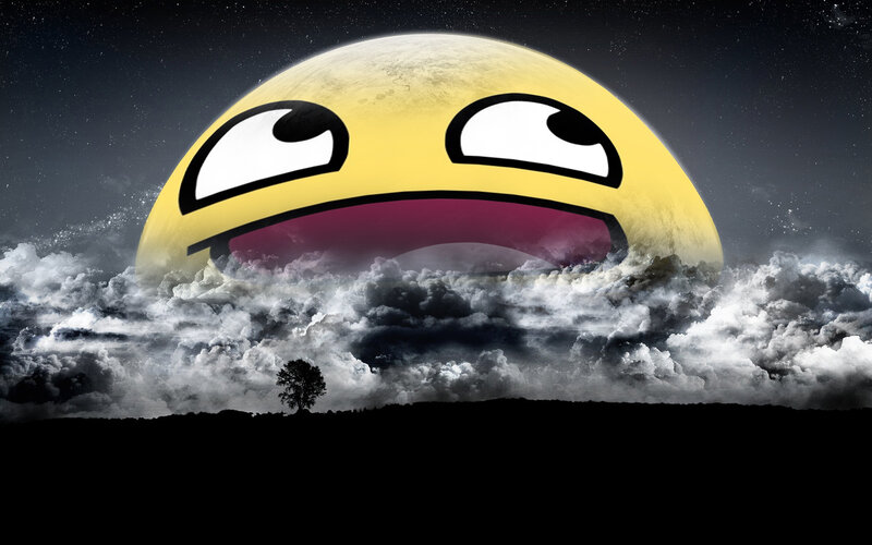 giant emoji moon over clouds