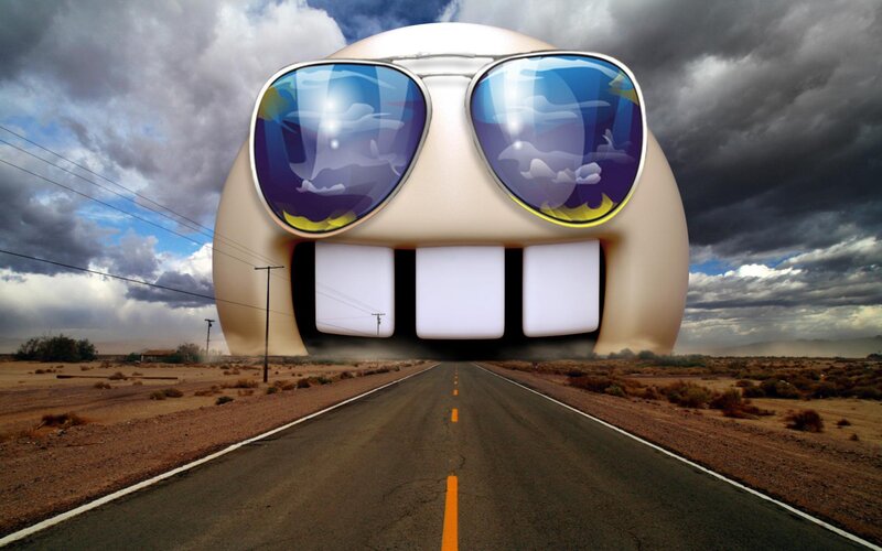 giant emoji on desert road