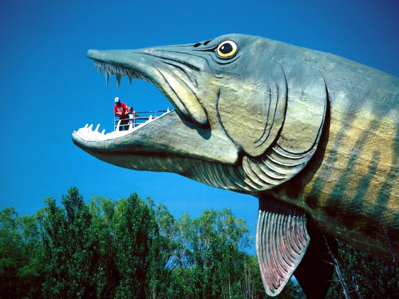 giant fish sculpture with people
