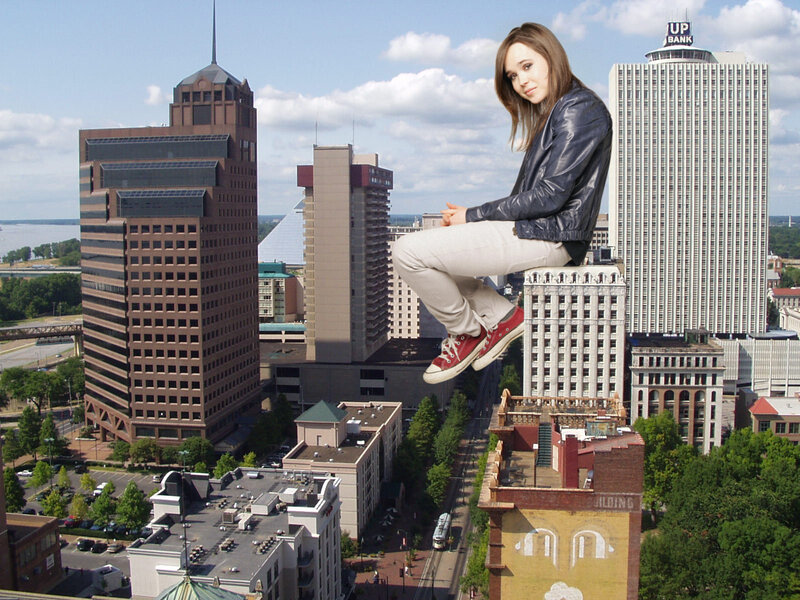 giant girl on city building