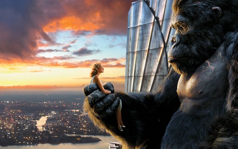 Giant gorilla holds woman