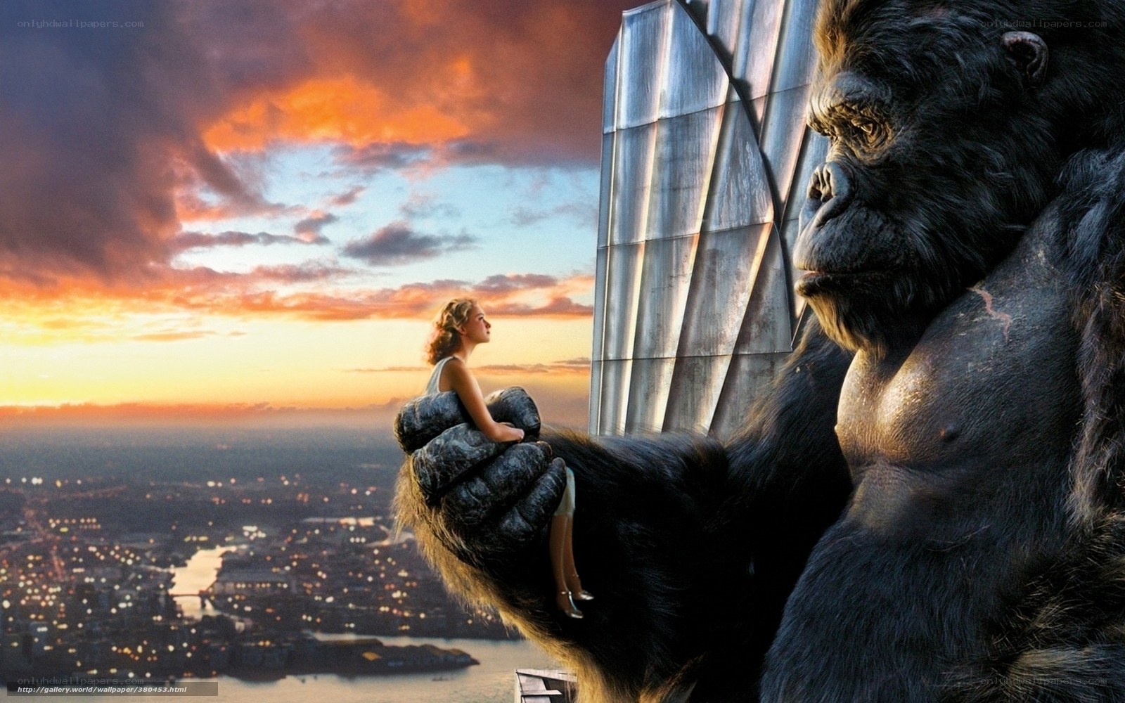 Giant gorilla holds woman