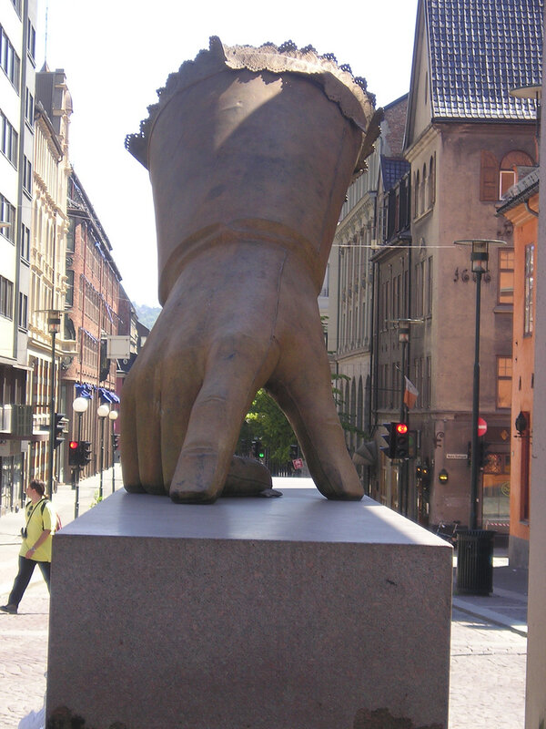 giant hand sculpture in city