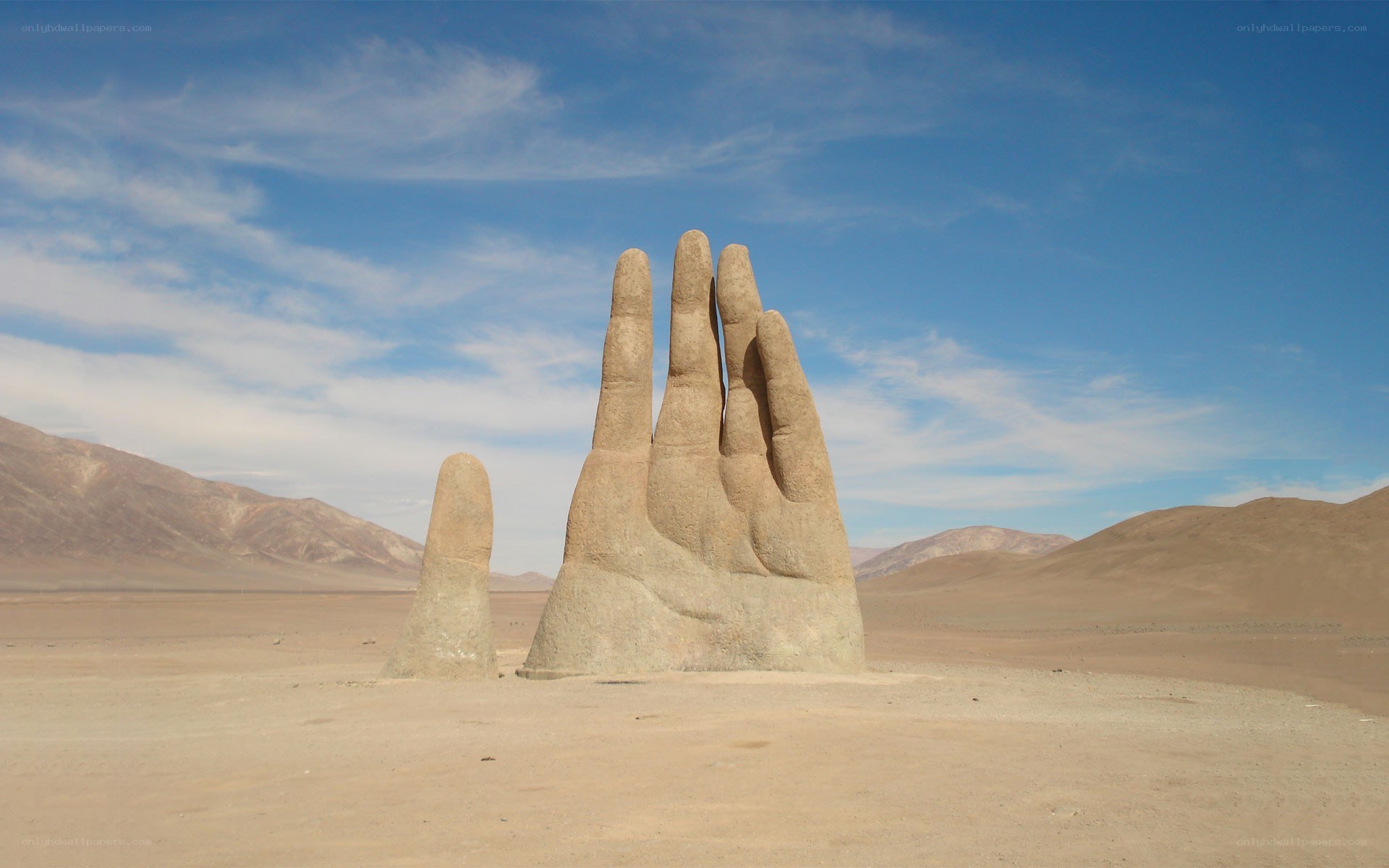 Giant hand sculptures in desert